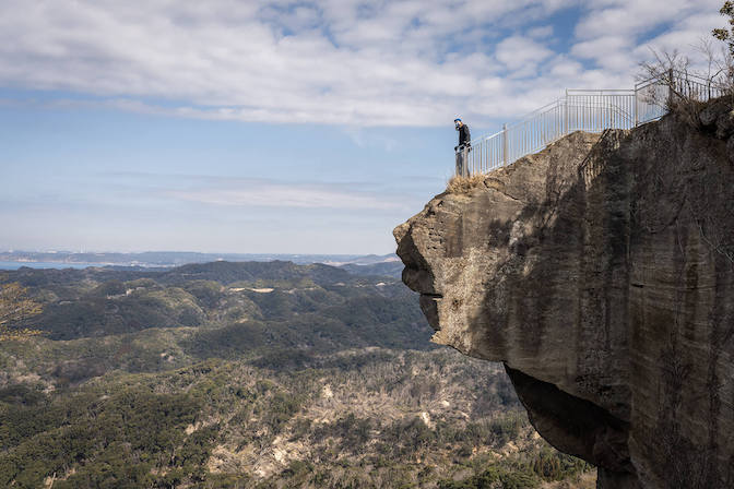 Man on Mountain Cliff